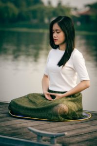 woman mindfully breathing