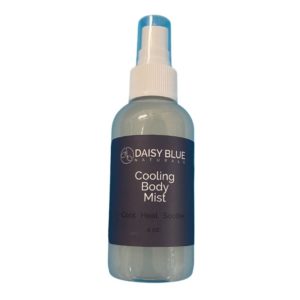 A clear spray bottle labeled "Daisy Blue Naturals Cooling Body Mist" (4 oz, "Cool. Heal. Soothe.") pairs perfectly with Summer Body Oil for refreshing hydration all day.