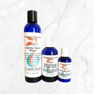 Three blue bottles of the 3 Step Face Set - Normal / Oily are displayed on a white marble background, labeled as Step 1 Gentle Face Wash, Step 2 Witch Hazel & Aloe Toner, and Step 3 Facial Moisturizer.