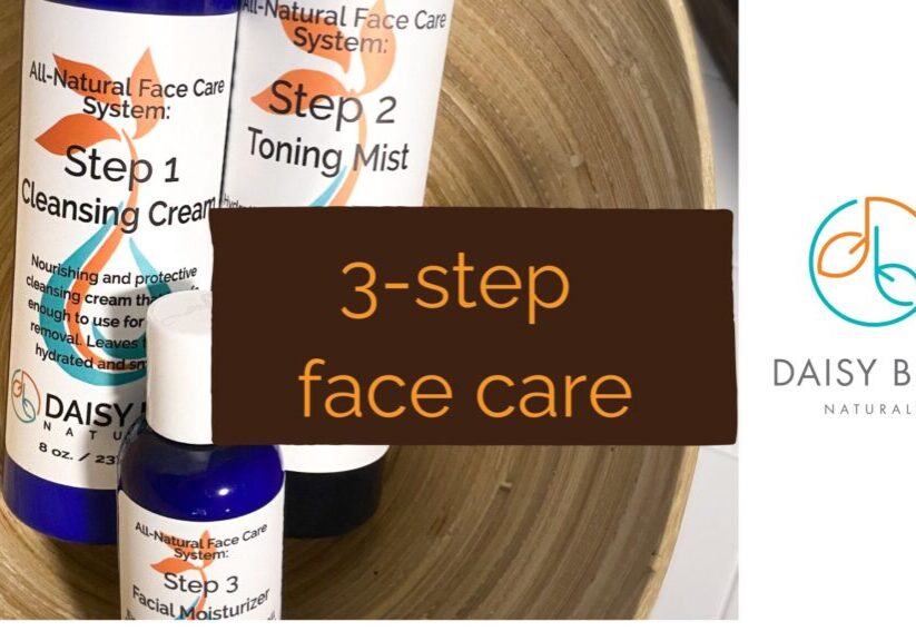 Three skincare products labeled Step 1 Cleansing Cream, Step 2 Toning Mist, and Step 3 Facial Moisturizer are arranged on a tray. Text reads "3-Step Skincare," with the Daisy Blue Naturals logo beside it for an easy step by step routine.