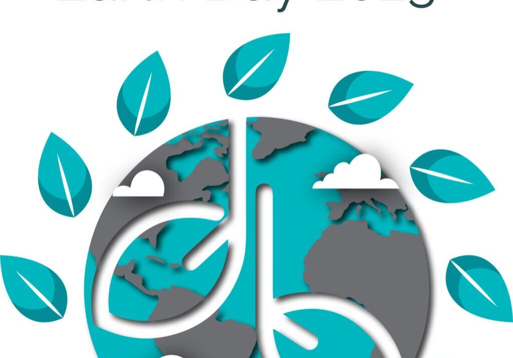 Earth Day 2023 graphic featuring a stylized globe with clouds and green leaves in a circle, highlighting our shared home. The globe displays North and South America, along with parts of Africa and Europe.
