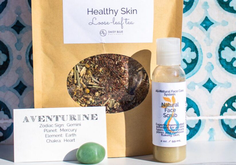 This image features one piece of Daisy Blue March News—the Spring Abundance Trio. It includes the Green Aventurine Stone, Healthy Skin Loose-Leaf Tea and Natural Facial Scrub.