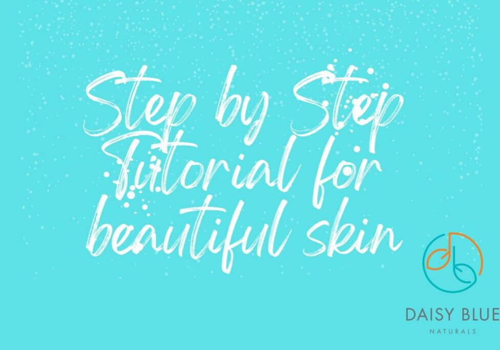 White handwritten text on a blue background reads, "Step by Step Natural Skincare Guide for beautiful skin." The Daisy Blue Naturals logo is in the bottom right corner. White speckles are scattered across the image.